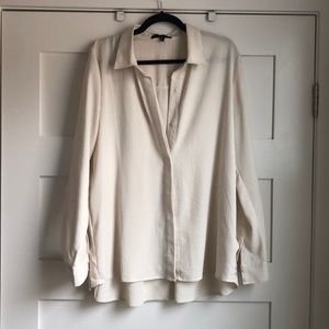 Cream colored long sleeve blouse